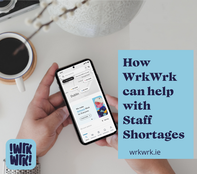 Hand holding phone, on on Wrkwrk app with text "How WrkWrk can help with Staff Shortages"